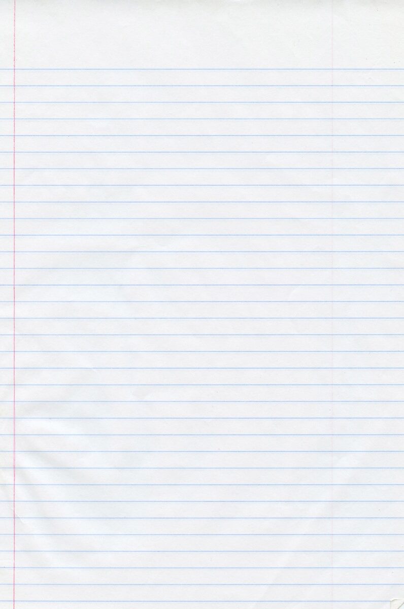 a piece of lined paper with red lines